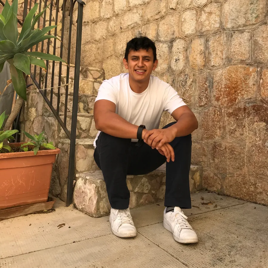 Marlon sitting on stone steps